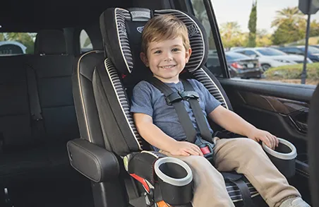 Properly installed complimentary toddler car seat in a Majestic Rides vehicle.